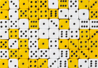 Background of 70 random ordered white and yellow dices