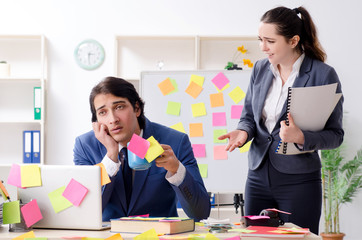 Two colleagues employees working in the office