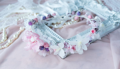 Wedding background with pearls and hair accessories on pink background