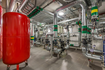 Modern independent heating system in boiler room. Expansion tank of ventilation system