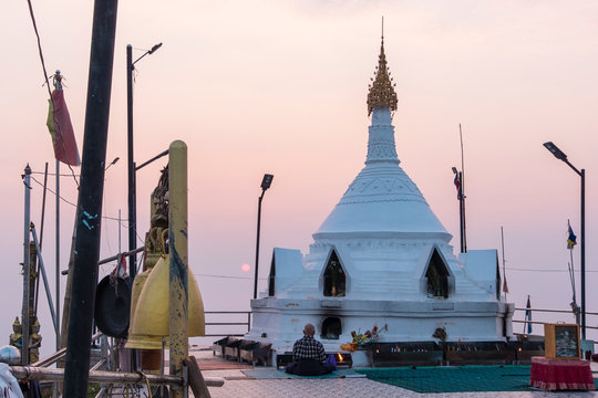 a man pray in front of pagoda, Mulayit Taung, Myanmar