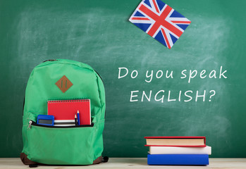 backpack, blackboard with text 