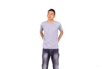 Young and thin Thai boy hands in his back pocket white background