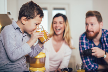 Happy family preparing food in the kitchen.
