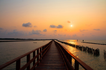 Obraz na płótnie Canvas Long Bridge at sea view on morning seascape sunrise background