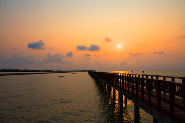 Obraz premium Long Bridge at sea view on morning seascape sunrise background