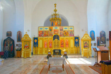 The interior of a small provincial church, the interior decoration. Icons, prayers. Russia