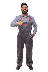 Portrait of happy young indian man builder giving thumbs up while standing at isolated white background with copy space.
