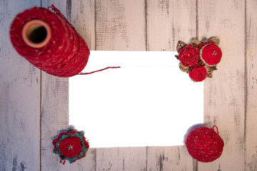 mockup fabric brooch with threads on wooden table