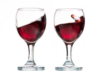 Fotobehang splash and flow from red wine in a glass, speed freeze © Vasily Popov