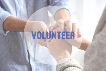 Man comforting woman on light background, closeup of hands. Help and support concept
