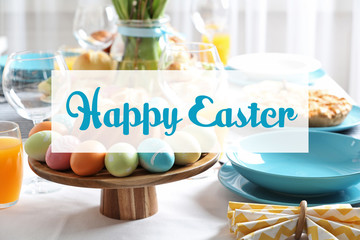 Festive Easter table setting with traditional meal, space for text
