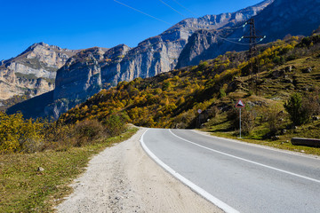 Caucasus mountains, autumn weather in the mountains. Panoramic view of the winding road and beautiful nature of the Caucasus