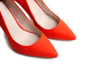 Stylish red female shoes on white background, closeup