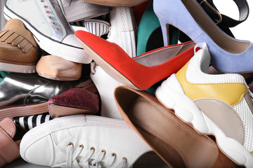 Different colorful female shoes as background, closeup
