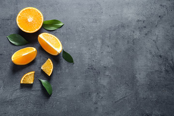 Flat lay composition with fresh oranges on grey background. Space for text