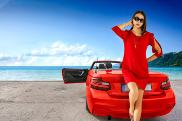 Red sport summer car and slim young woman in dress. 