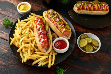 frankfurter Sausage hotdogs with french potato fries, chips crinkle cut gherkins, ketchup and...