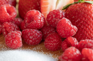 Strawberry. Raspberry. Fruits. Sugar. Raw. Macro. Red