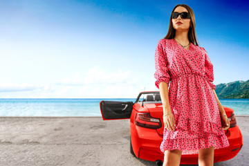 Slim young woman in dress and summer car 