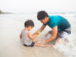 Children are always happy when playing sea water.