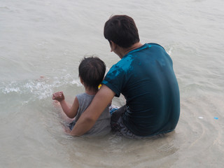 Children are always happy when playing sea water.