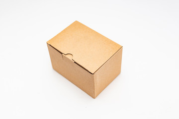 close-up view of a cardboard box over white background