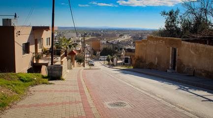 Fototapeta na wymiar Modern village street with blue sky in Madaba Jordan