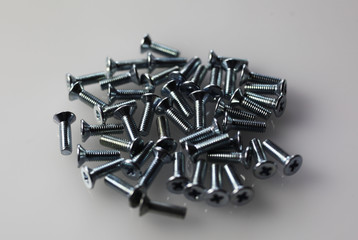 Screws are scattered on the table
