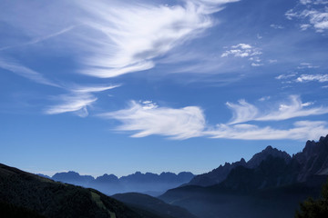Cloud Game - The clouds create a fantastic picture in the sky over a mountain panorama in the Alps
