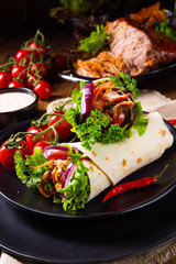 Tasty wraps filled with pulled pork and salad