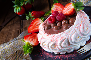 light pavlova with fresh fruits and chocolate