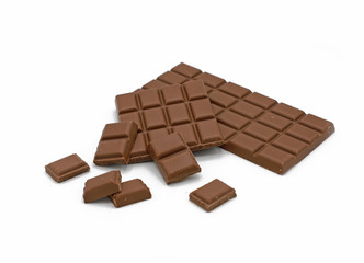 Milk chocolate bar and chocolate pieces isolated on white background