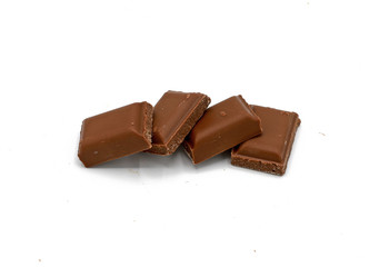Milk chocolate pieces - isolated on white