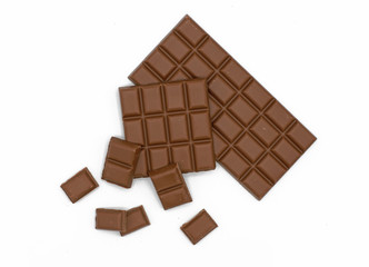 Milk chocolate bar and chocolate pieces isolated on white background