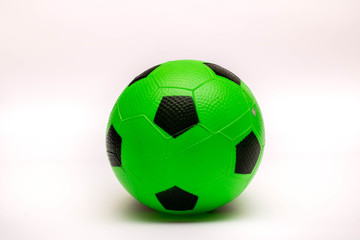 Colorful ball. Green baby ball for soccer on the white background.