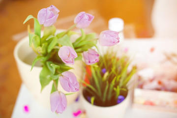 Pink tulips in a vase on a kitchen table. Good beginning of the day. Morning mood. Spring concept. Sunny spring morning with flowers.