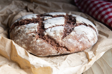 rye bread on a rustic table with a plaid cloth