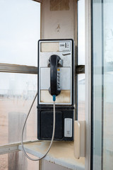 An old telephone booth in Farmland ,CO, USA.