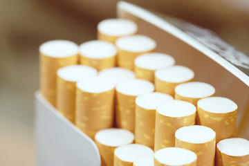 peel it off Cigarette pack prepare smoking a cigarette. Packing line up.  photo filters Natural light. soft focus.