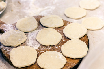 Preparing, cooking, making homemade dumplings with cabbage.