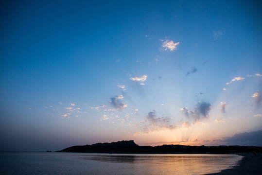 Sunset on the Beach of Rena di Ponente, Sardinia Island.