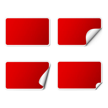 Set of red rectangle adhesive stickers with a folded edges, isolated on white background.