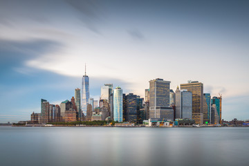 New York, New York, USA skyline on the bay at twilight.