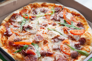  Delicious round pizza with vegetables and ham.