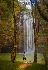 man at the waterfall