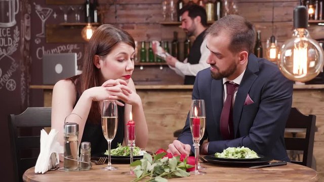 Sad young woman, looking disappointed at a blind date. Unhappy young woman finds out bad news.