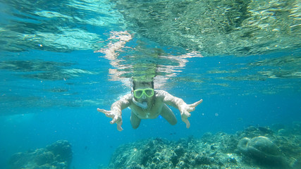 snorkeling the man under water with a mask the Indian Ocean