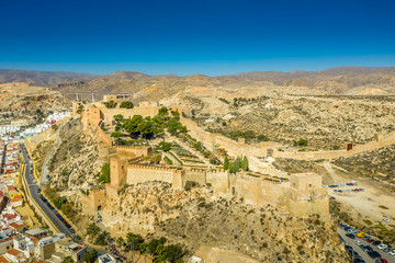 Fototapeta na wymiar Almeria medieval castle panorama with blue sky from the air in Andalusia Spain former Arab stronghold