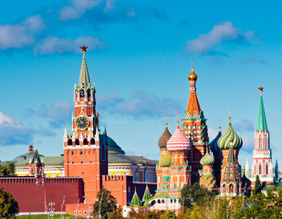 Spasskaya Tower of Moscow Kremlin and Cathedral of Vasily the Blessed (Saint Basil's Cathedral) in sunny day. Red Square. Moscow. Russia